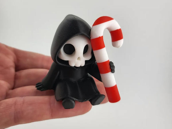 Sitting Grim Reaper with Candy Cane - Cute Goth Christmas Shelf Sitter